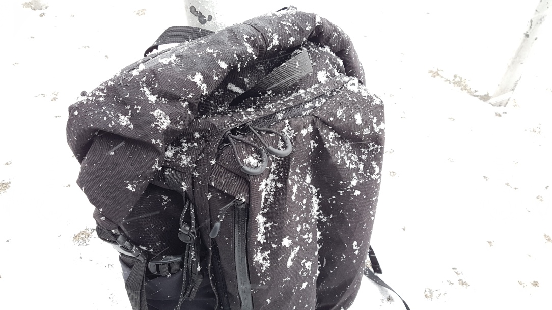 Remote Equipment Alpha 31 Backpack snow covered zipper pulls