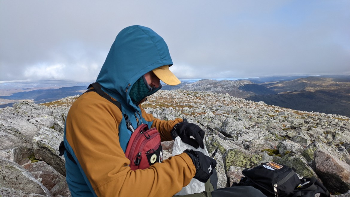 Osprey Archeon Chest Rig Review outdoors mountain terrain side view Outdoor Research Ferrosi Hoody