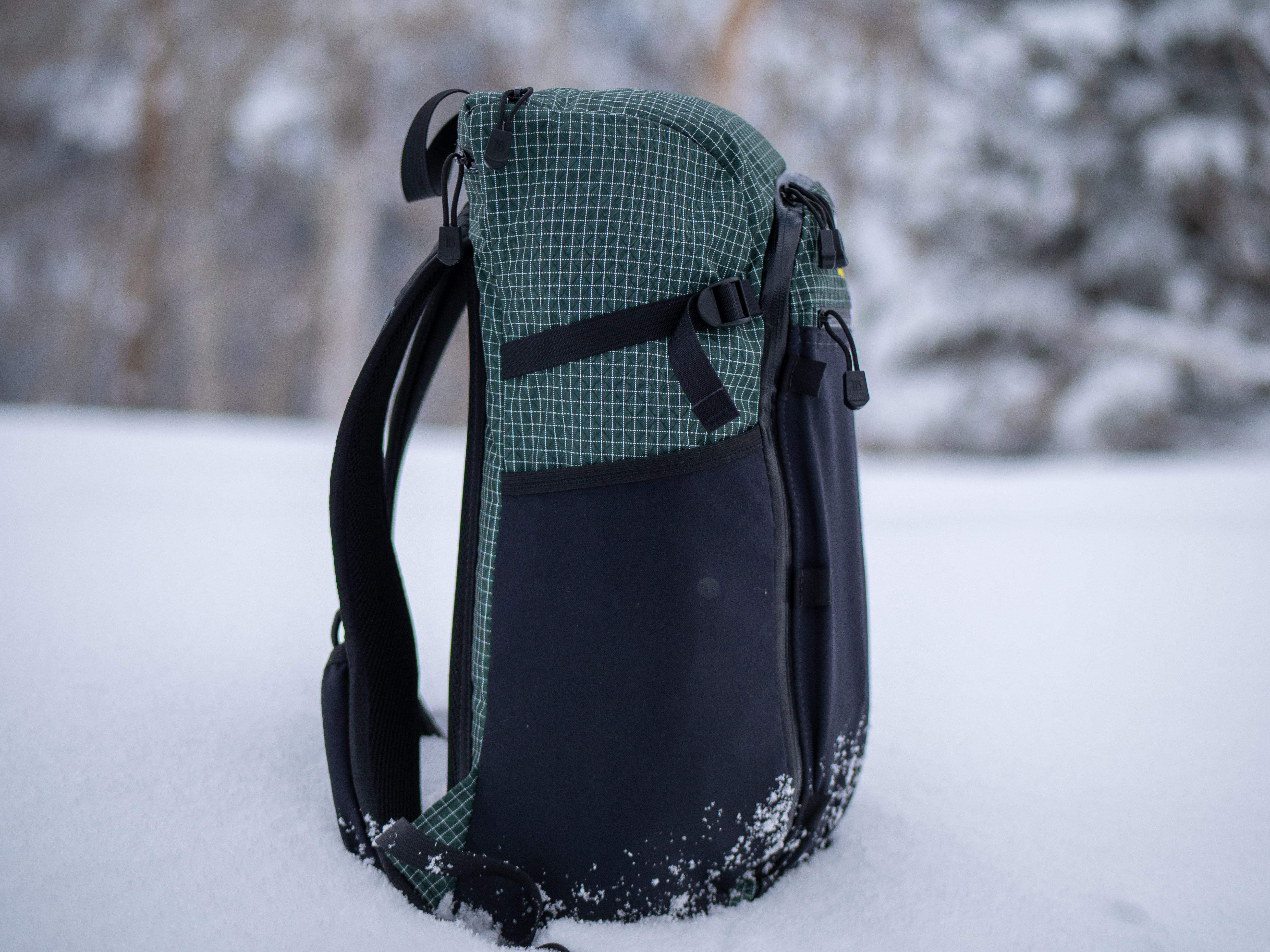 ula ultralight equipment dragonfly side of pack in snow with bottle pockets