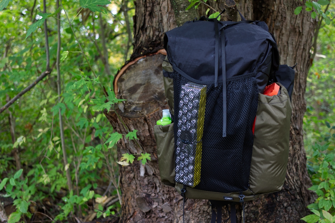 Superior Wilderness Designs Long Haul 50 Review front view of bag in trees