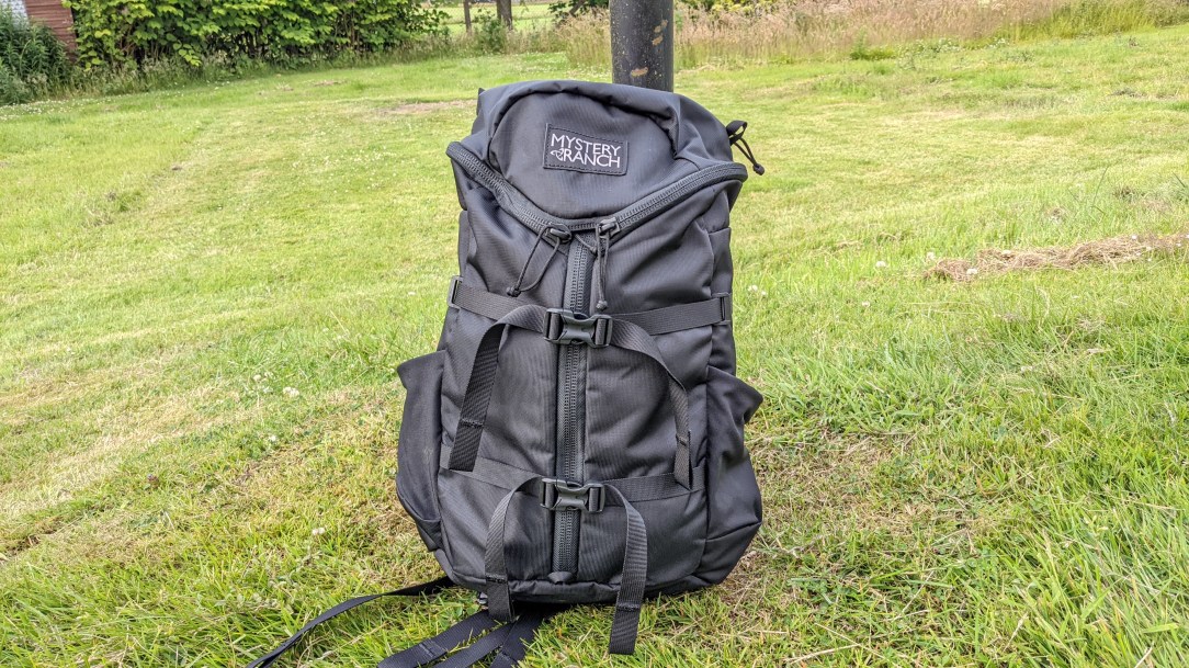 Mystery Ranch Gallagator backpack review black pack on grass outdoor front view