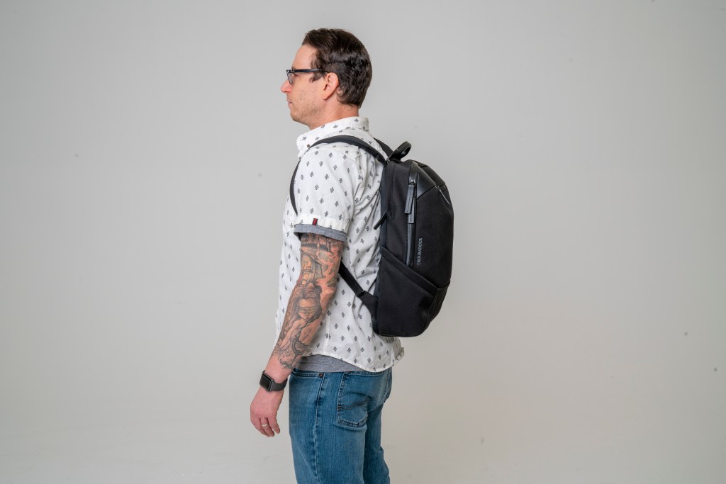 Troubadour Apex backpack review faux vegan leather backpack side view profile on body
