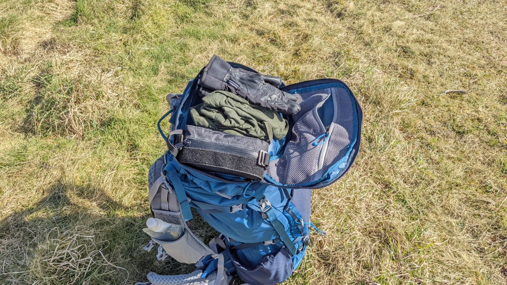 Mystery Ranch Bridger 55 backpack review lid pocket mesh brain compartment clamshell zip opening gloves powerbank key leash secure area